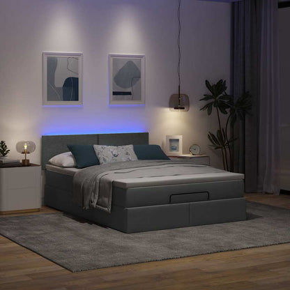 Ottoman bed met matras en LED's 140x200 cm stof donkergrijs