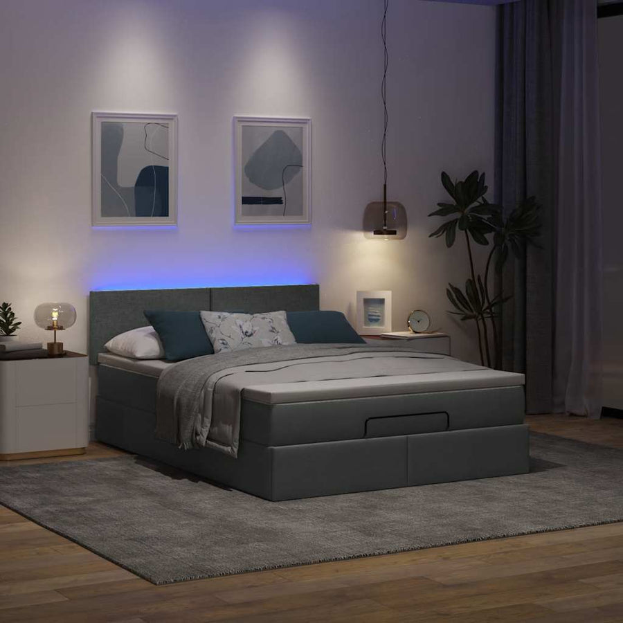 Ottoman bed met matras en LED's 140x200 cm stof donkergrijs