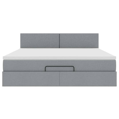 Ottoman bed met matras en LED's 160x200 cm stof lichtgrijs