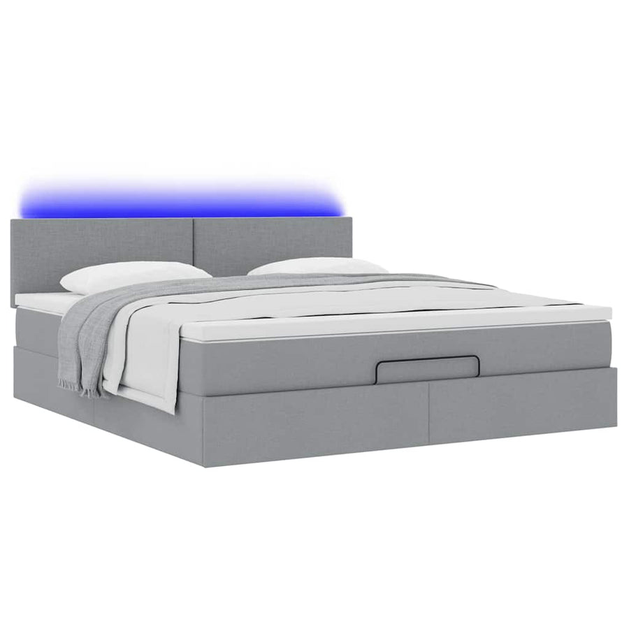 Ottoman bed met matras en LED's 180x200cm stof lichtgrijs