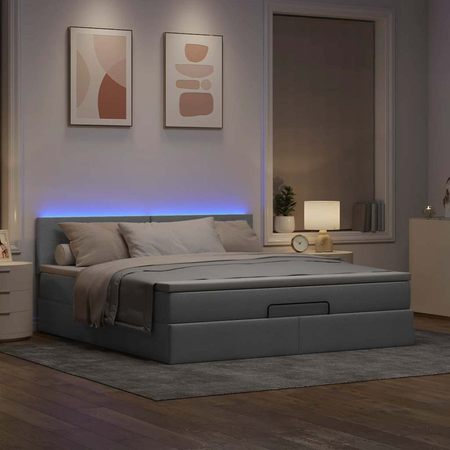 Ottoman bed met matras en LED's 180x200cm stof lichtgrijs