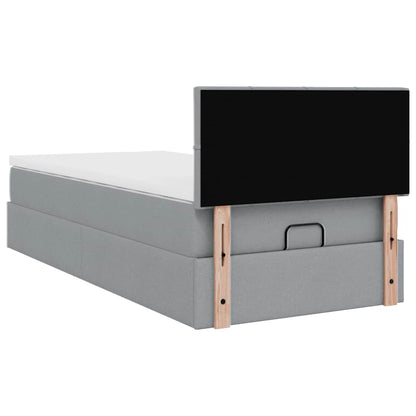 Ottoman bed met matras en LED's 80x200cm stof lichtgrijs