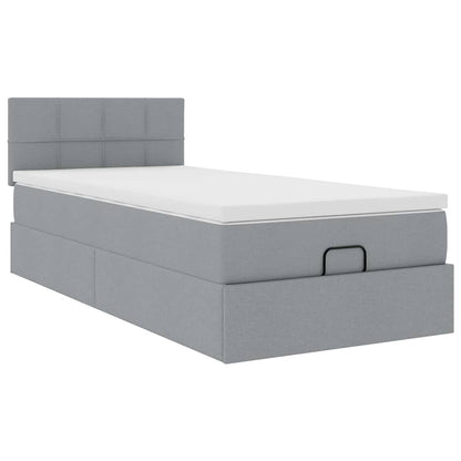Ottoman bed met matras en LED's 90x200 cm stof lichtgrijs