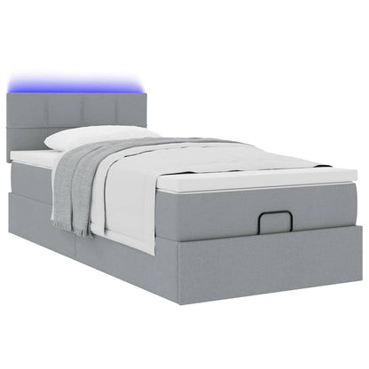 Ottoman bed met matras en LED's 100x200 cm stof lichtgrijs