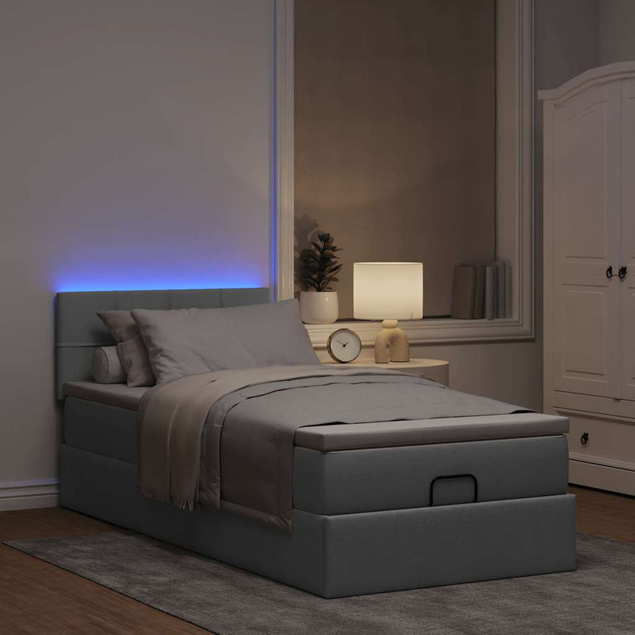 Ottoman bed met matras en LED's 100x200 cm stof lichtgrijs