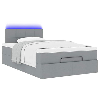 Ottoman bed met matras en LED's 120x190 cm stof lichtgrijs