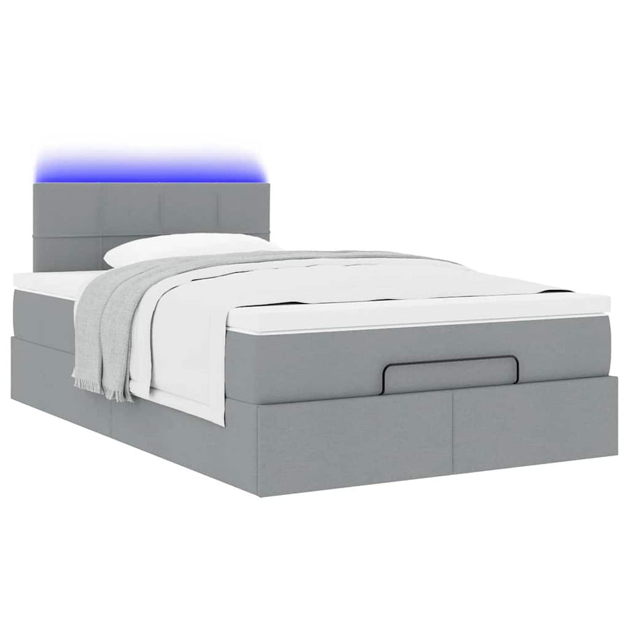 Ottoman bed met matras en LED's 120x190 cm stof lichtgrijs