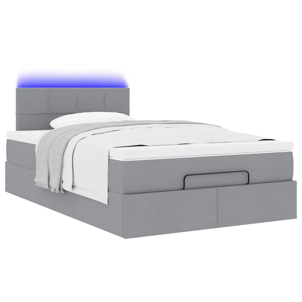 Ottoman bed met matras en LED's 120x200 cm stof lichtgrijs