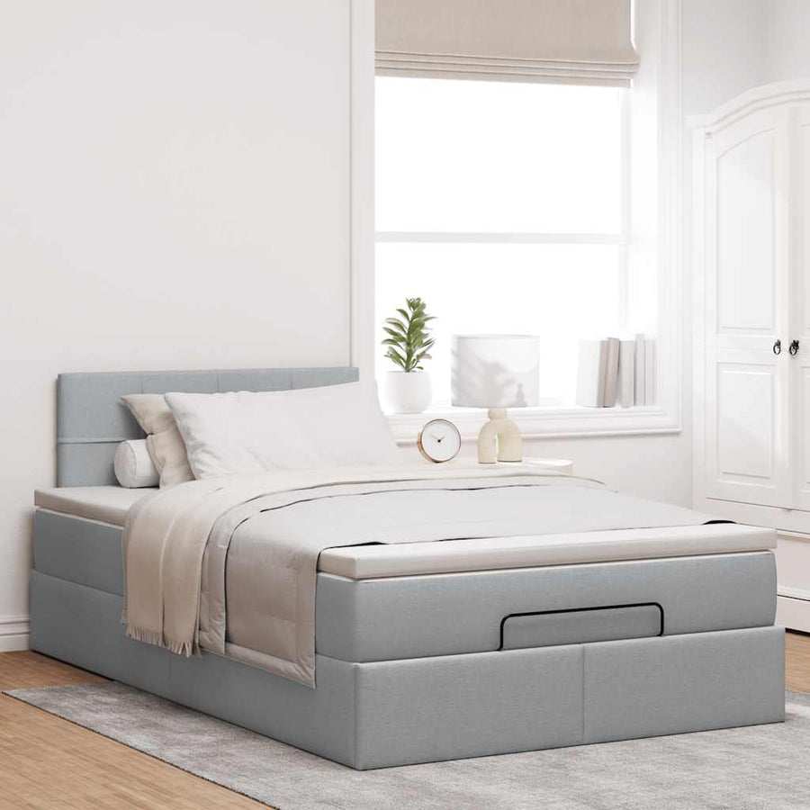 Ottoman bed met matras en LED's 120x200 cm stof lichtgrijs