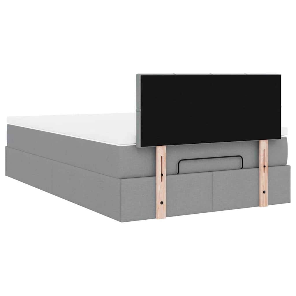 Ottoman bed met matras en LED's 120x200 cm stof lichtgrijs