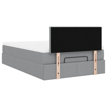 Ottoman bed met matras en LED's 120x200 cm stof lichtgrijs