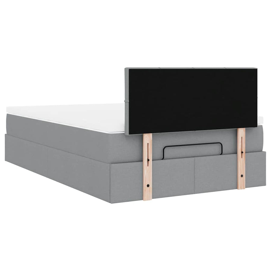 Ottoman bed met matras en LED's 120x200 cm stof lichtgrijs