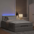 Ottoman bed met matras en LED's 120x200cm stof taupe