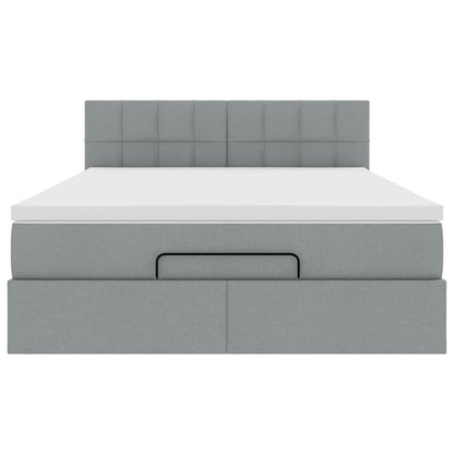 Ottoman bed met matras en LED's 140x200cm stof lichtgrijs