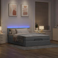 Ottoman bed met matras en LED's 140x200cm stof lichtgrijs