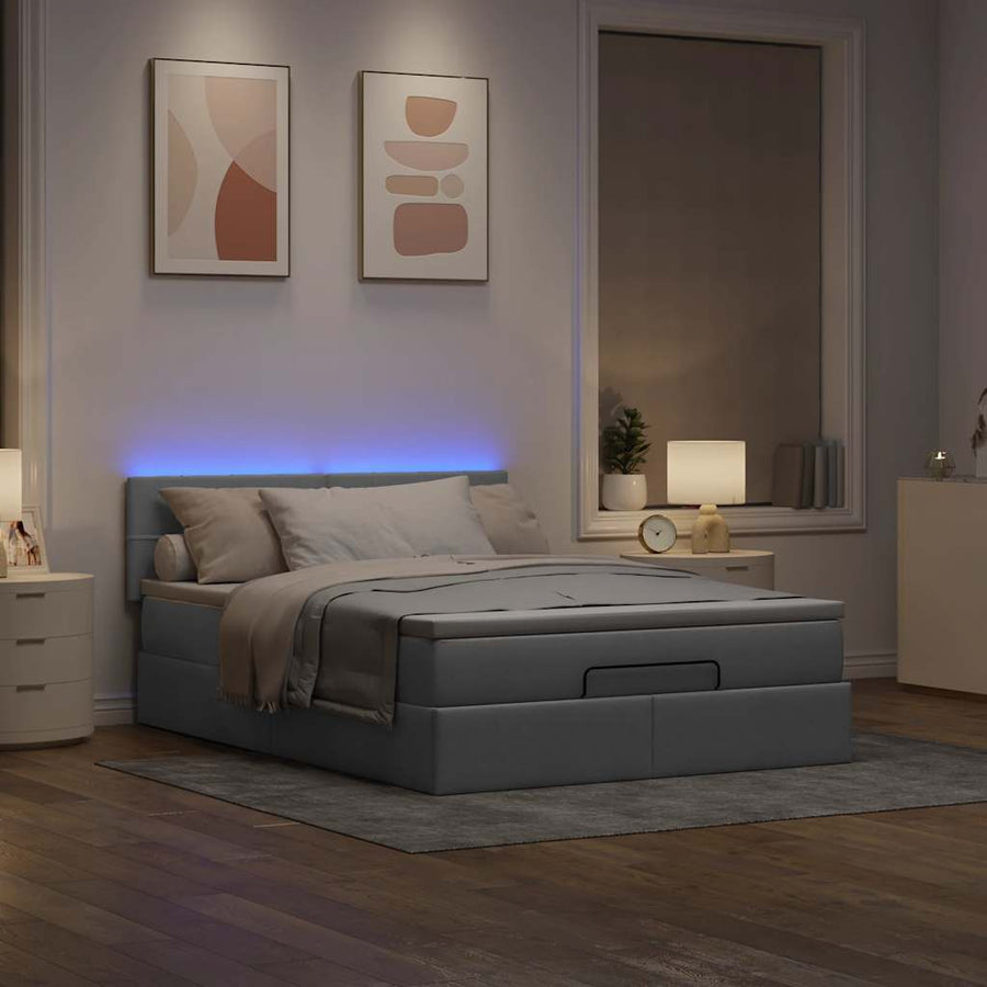 Ottoman bed met matras en LED's 140x200cm stof lichtgrijs
