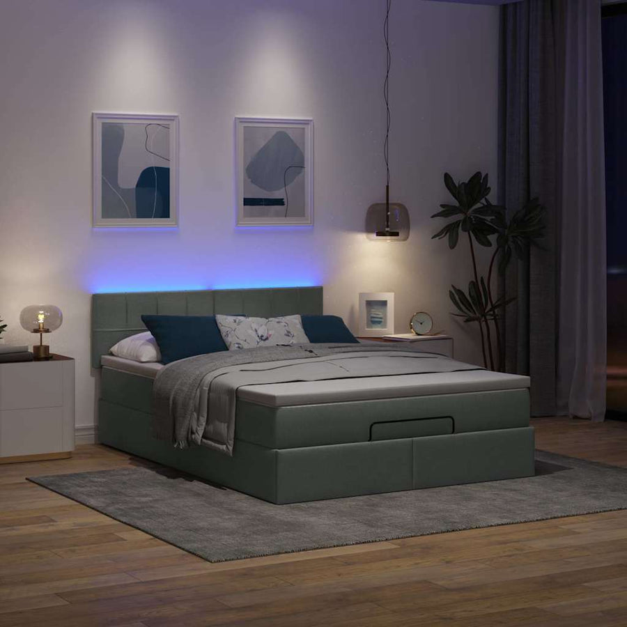 Ottoman bed met matras en LED's 140x200 cm stof donkergrijs