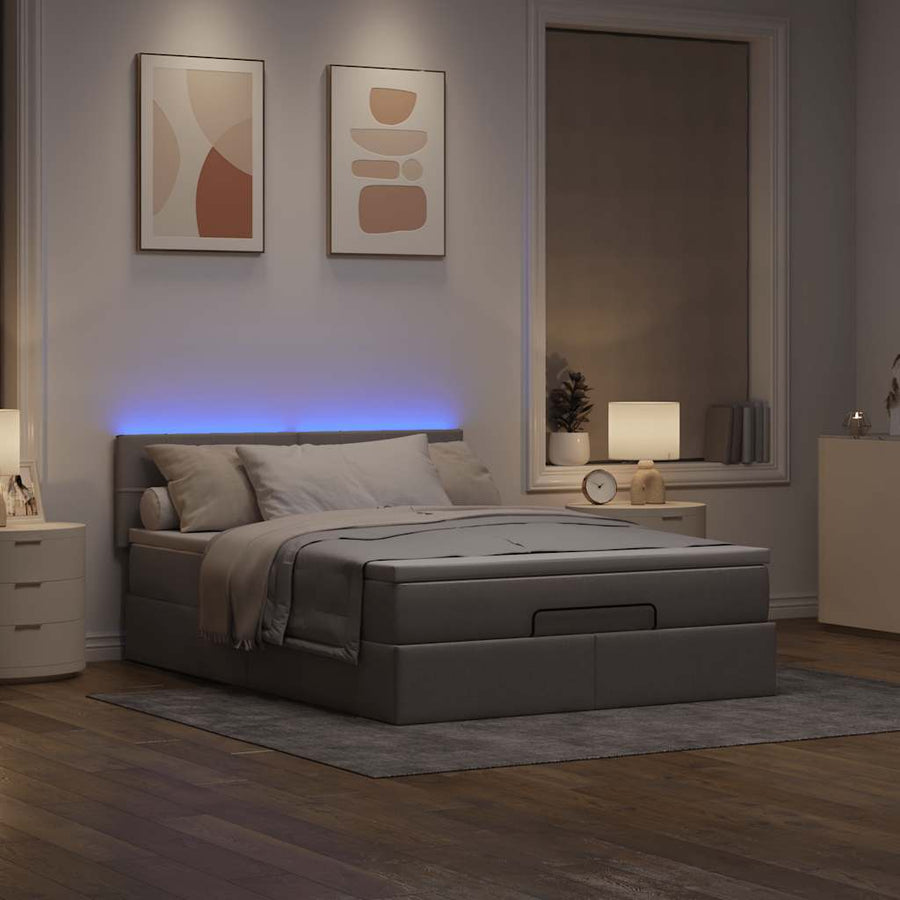 Ottoman bed met matras en LED's 140x200 cm stof taupe
