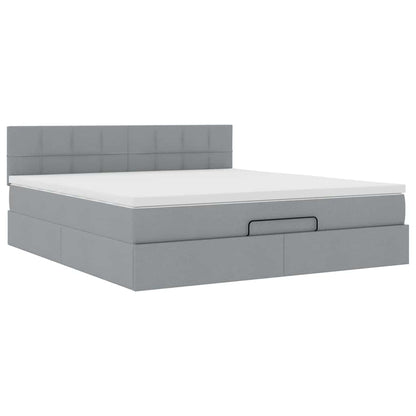 Ottoman bed met matras en LED's 160x200 cm stof lichtgrijs