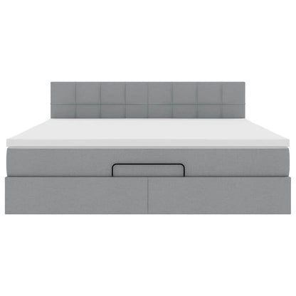 Ottoman bed met matras en LED's 160x200 cm stof lichtgrijs