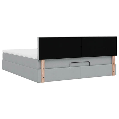 Ottoman bed met matras en LED's 160x200 cm stof lichtgrijs