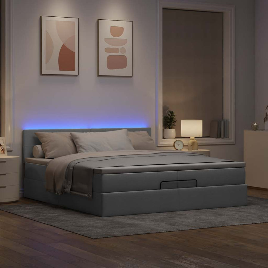Ottoman bed met matrassen en LED's 200x200cm stof lichtgrijs