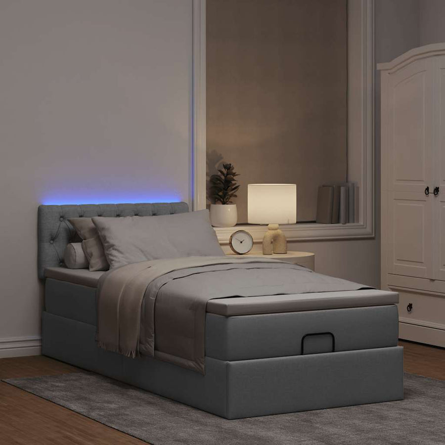 Ottoman bed met matras en LED's 80x200cm stof lichtgrijs