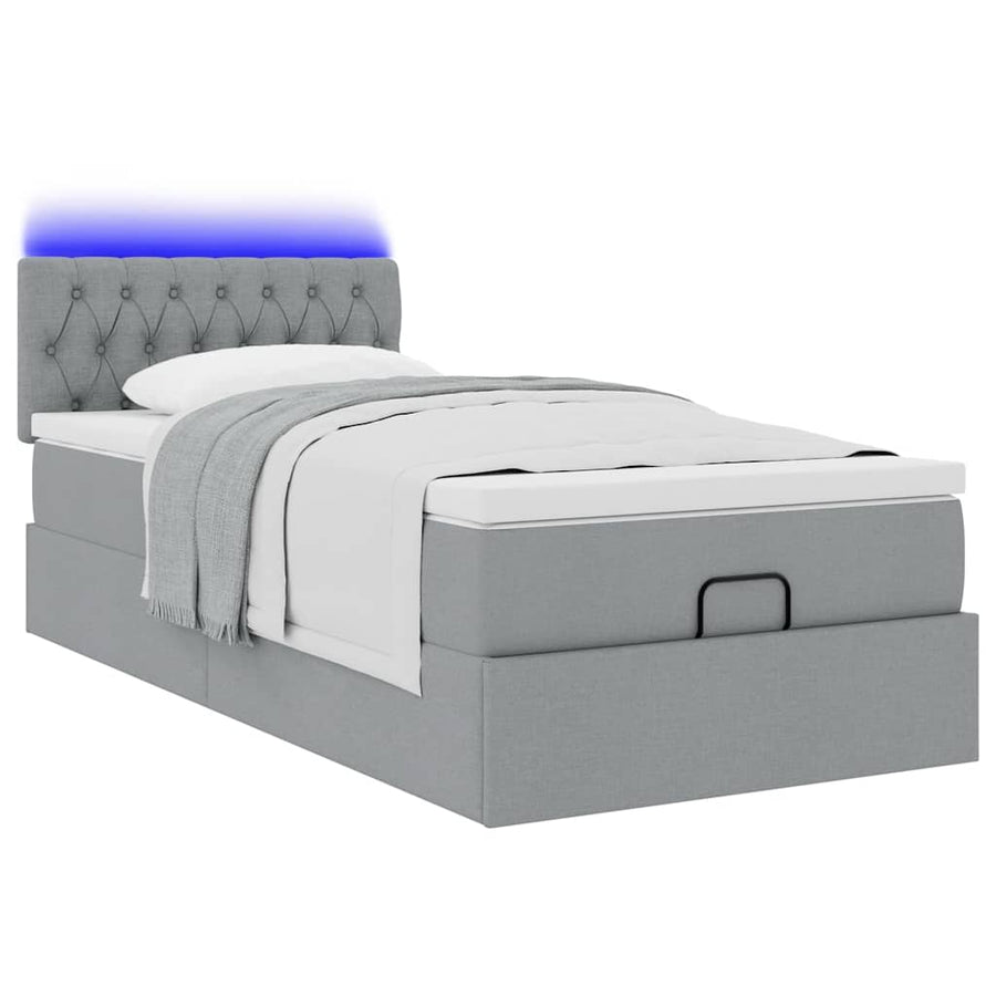 Ottoman bed met matras en LED's 90x200 cm stof lichtgrijs