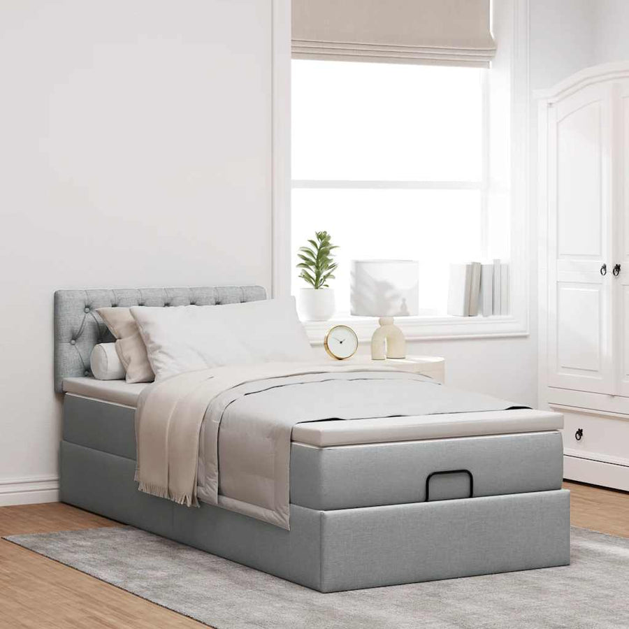 Ottoman bed met matras en LED's 90x200 cm stof lichtgrijs
