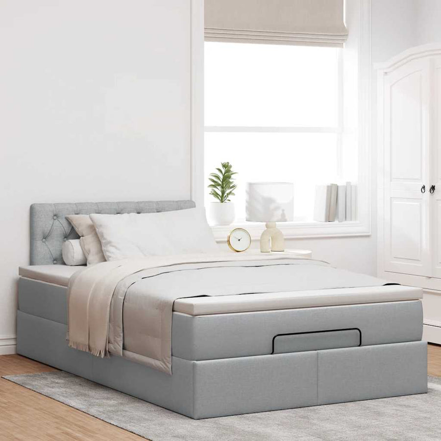 Ottoman bed met matras en LED's 120x200 cm stof lichtgrijs