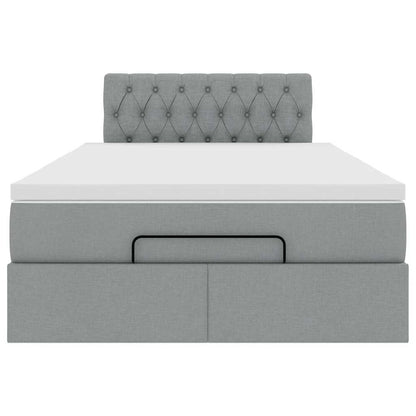 Ottoman bed met matras en LED's 120x200 cm stof lichtgrijs
