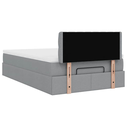 Ottoman bed met matras en LED's 120x200 cm stof lichtgrijs