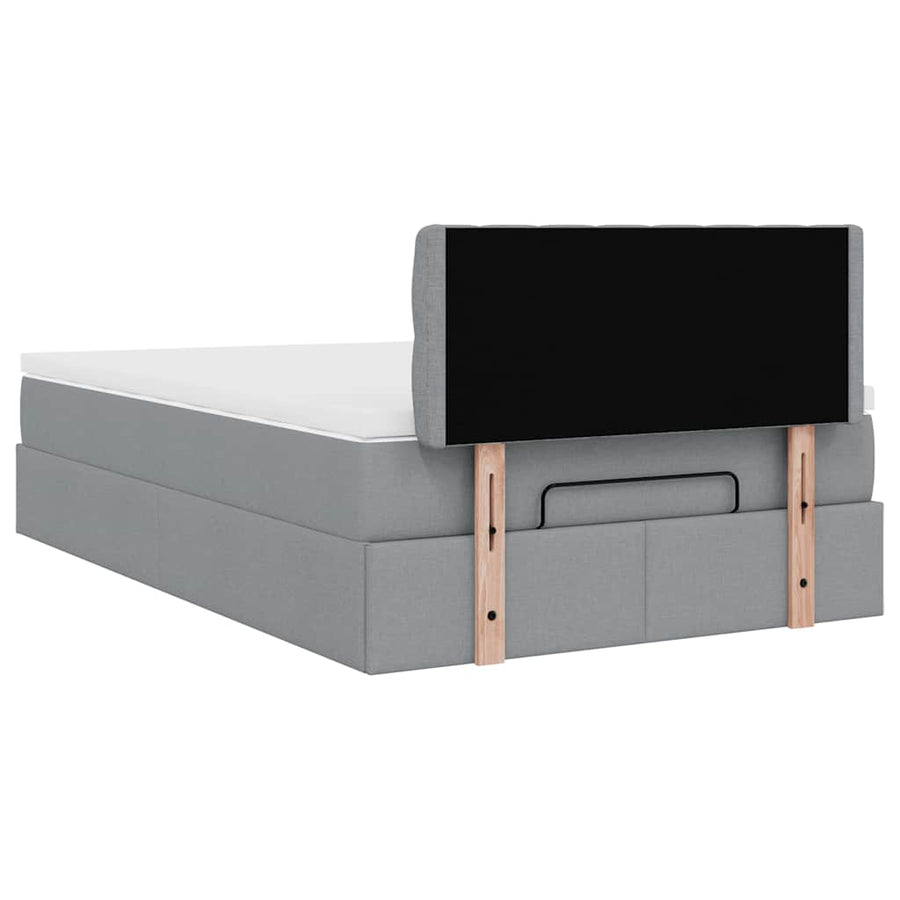 Ottoman bed met matras en LED's 120x200 cm stof lichtgrijs