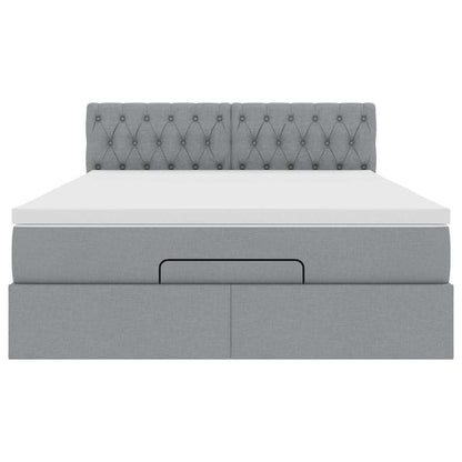 Ottoman bed met matras en LED's 140x200cm stof lichtgrijs