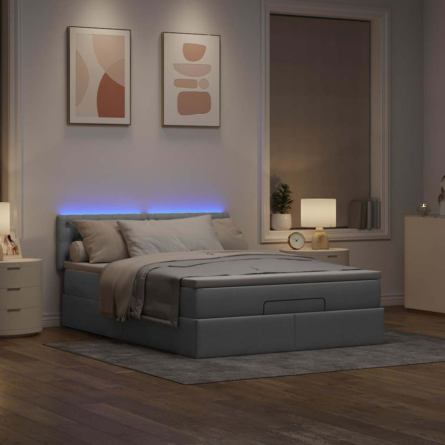 Ottoman bed met matras en LED's 140x200cm stof lichtgrijs