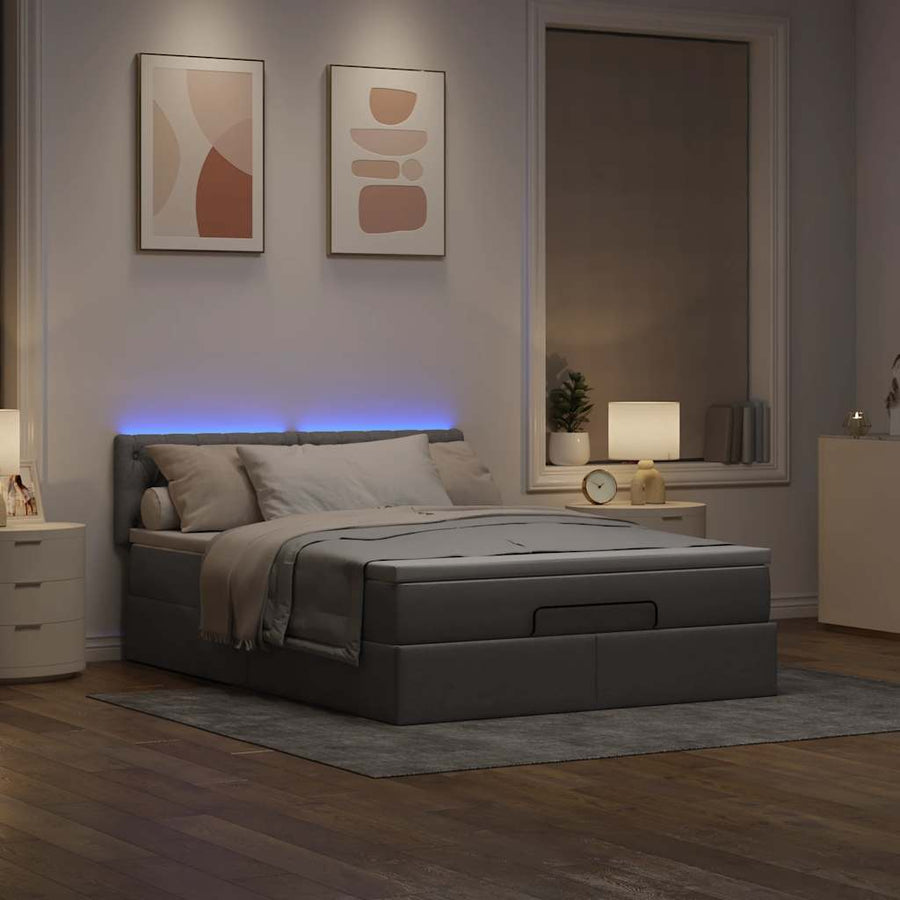 Ottoman bed met matras en LED's 140x200 cm stof taupe
