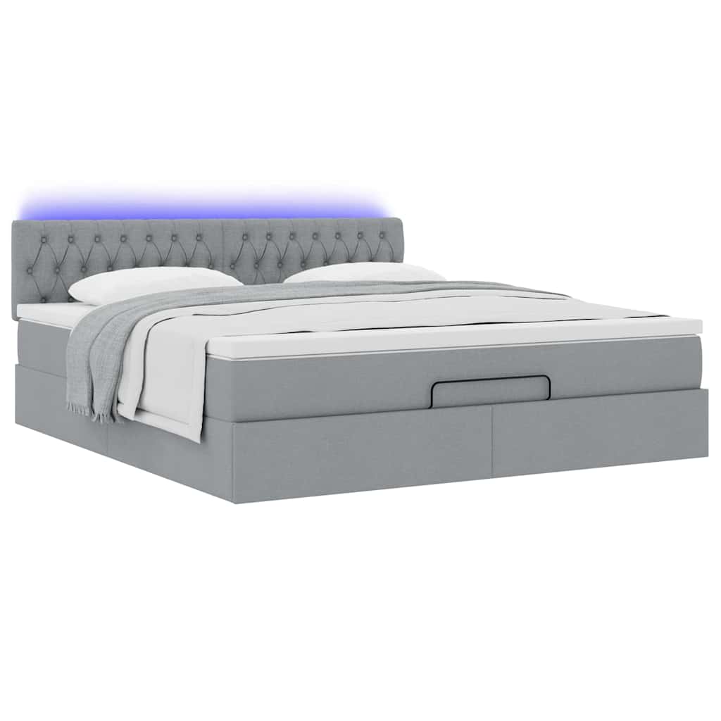 Ottoman bed met matras en LED's 160x200 cm stof lichtgrijs