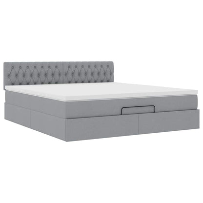 Ottoman bed met matras en LED's 160x200 cm stof lichtgrijs