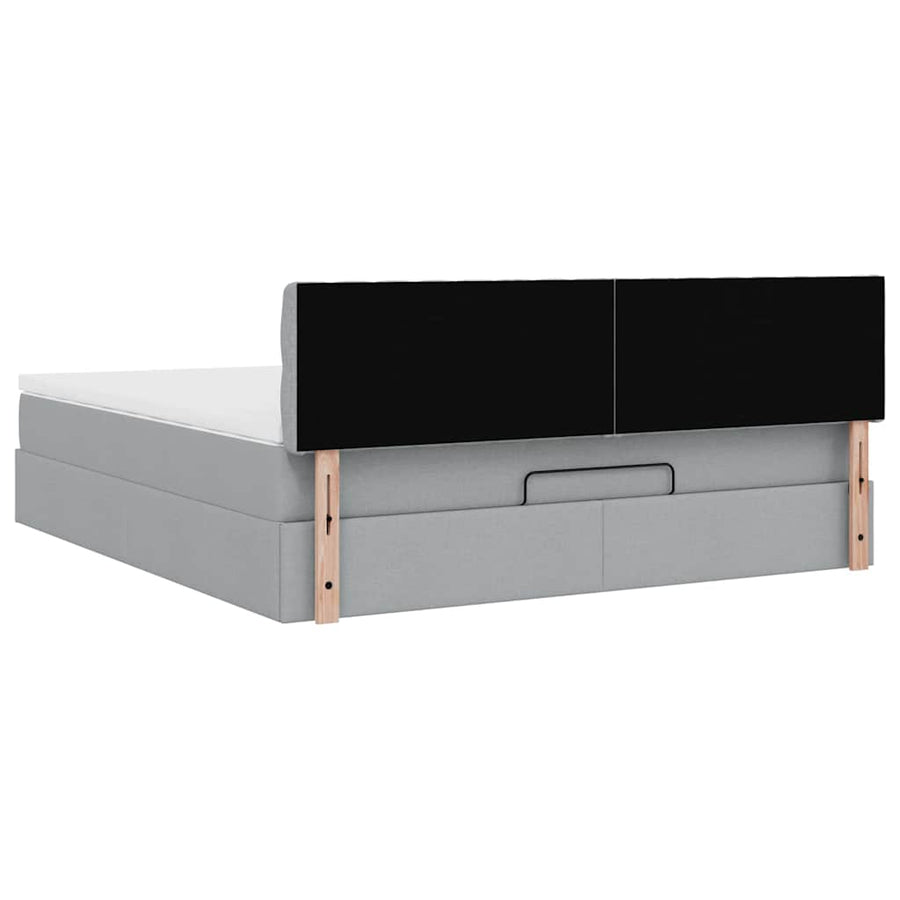 Ottoman bed met matras en LED's 160x200 cm stof lichtgrijs