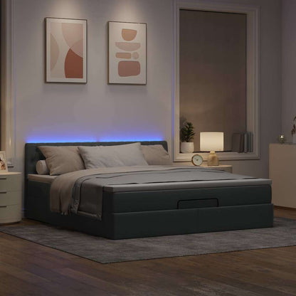 Ottoman bed met matras en LED's 160x200 cm stof lichtgrijs