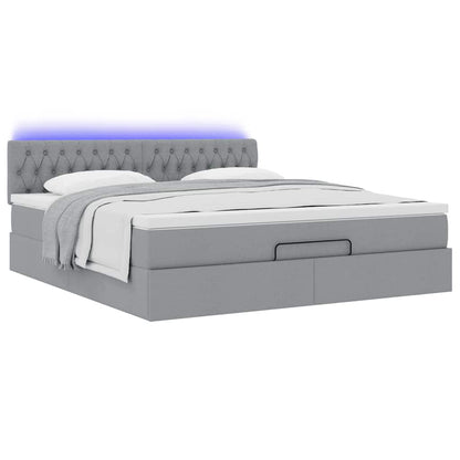 Ottoman bed met matras en LED's 180x200cm stof lichtgrijs