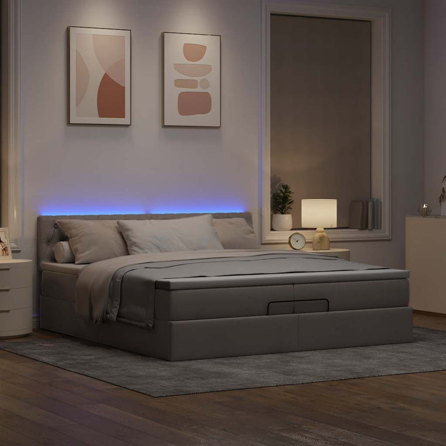 Ottoman bed met matrassen en LED's 200x200cm stof taupe