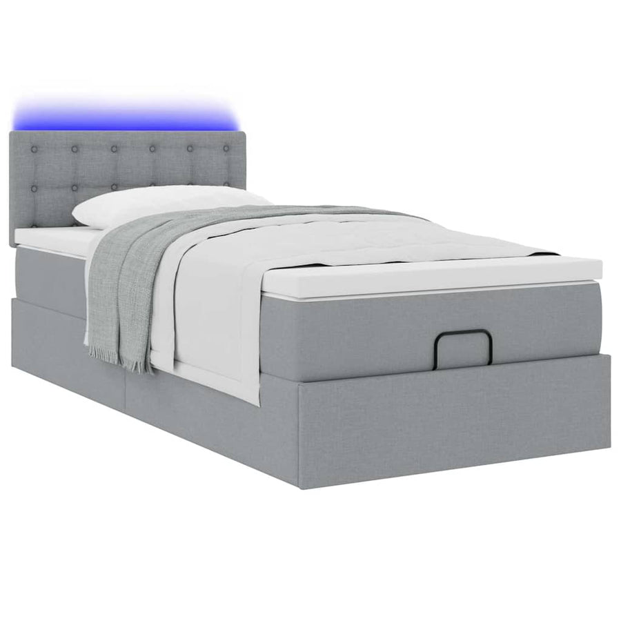 Ottoman bed met matras en LED's 90x200 cm stof lichtgrijs