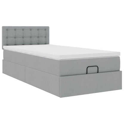 Ottoman bed met matras en LED's 90x200 cm stof lichtgrijs