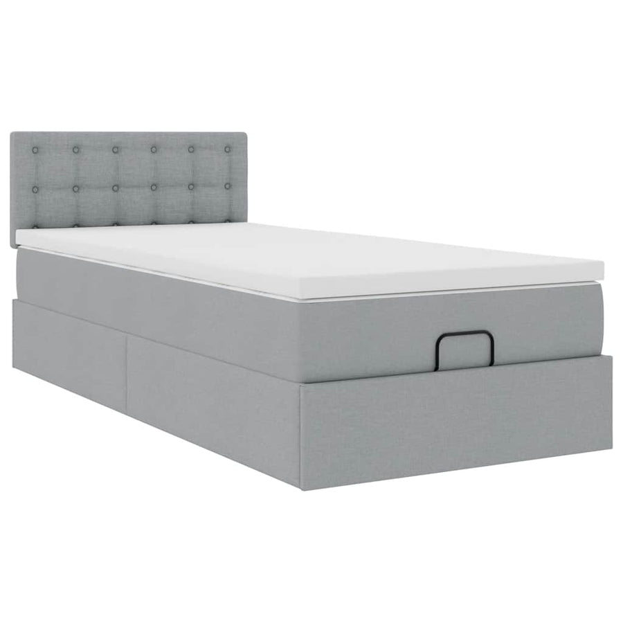 Ottoman bed met matras en LED's 90x200 cm stof lichtgrijs