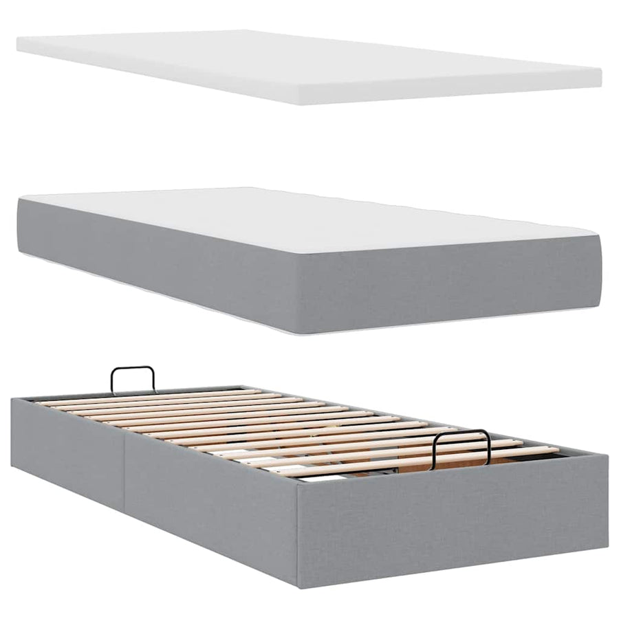Ottoman bed met matras en LED's 90x200 cm stof lichtgrijs