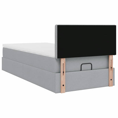 Ottoman bed met matras en LED's 90x200 cm stof lichtgrijs