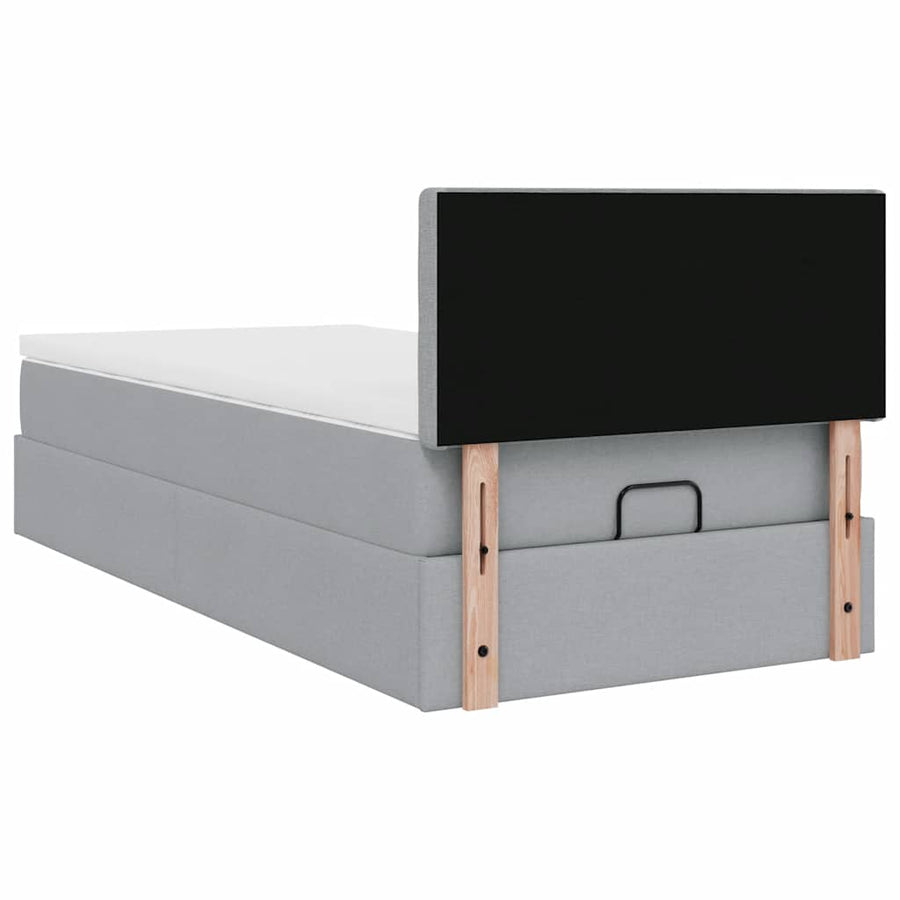 Ottoman bed met matras en LED's 90x200 cm stof lichtgrijs