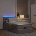 Bed poef met matras en LED's 90x200 cm stof taupe