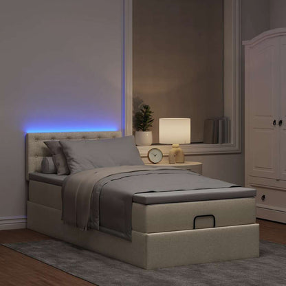 Ottoman bed met matras en LED's 90x200 cm stof crèmekleurig
